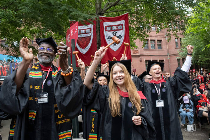 Harvard Law School graduates cheer during the 374th Harvard Commencement in Harvard Yard in Cambridge, Massachusetts, on May 29, 2025. (AFP)