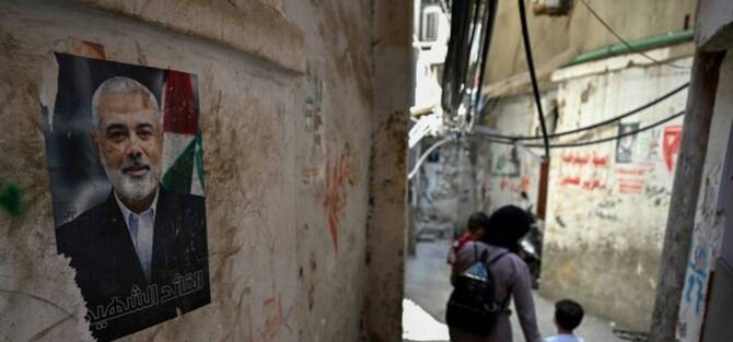 A poster of Palestinian Hamas movement's slain political chief Ismail Haniyeh in an alleyway at the Burj al Barajneh camp for Palestinian refugees in Beirut. (AFP)