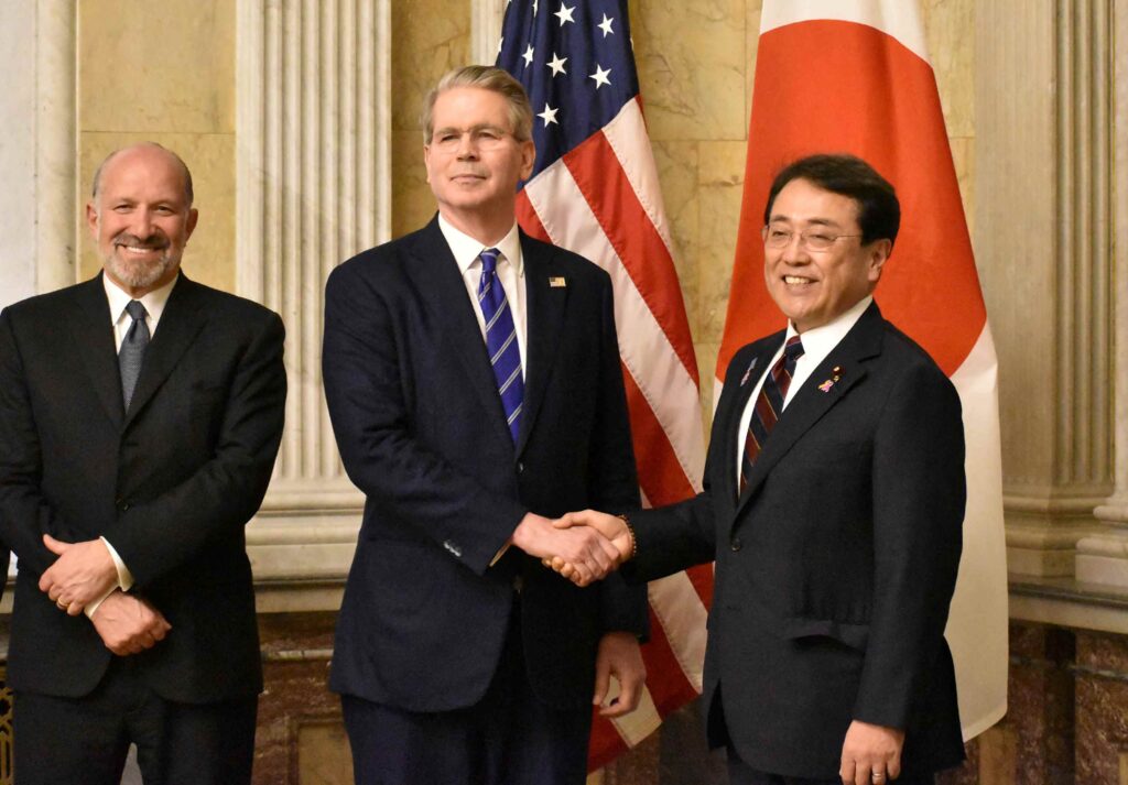 Japan's Economic Revitalisation Minister Ryosei Akazawa (R) poses with US Treasury Secretary Scott Bessent (C) and Commerce Secretary Howard Lutnick (L) in Washington DC on May 1, 2025. (AFP)