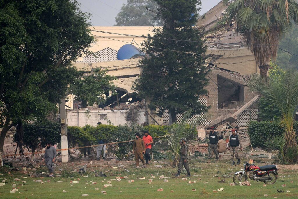 Paramilitary soldiers inspect a collapsed building of the Government Health and Educational complex after Indian strikes in Muridke, about 30 kilometres from Lahore, on May 7, 2025. (AFP)