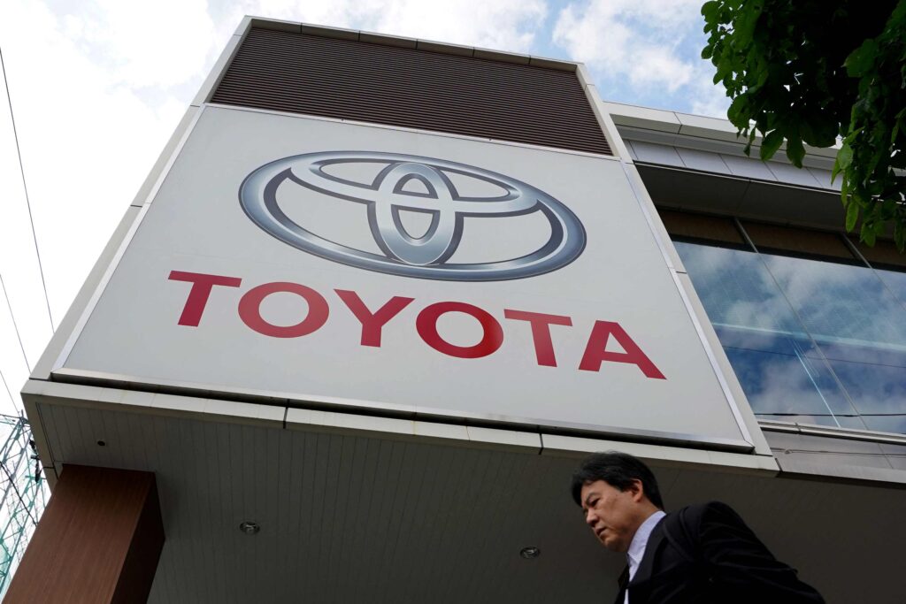 The logo of Toyota Motor is displayed at a car showroom in Tokyo on May 8, 2025. (AFP)