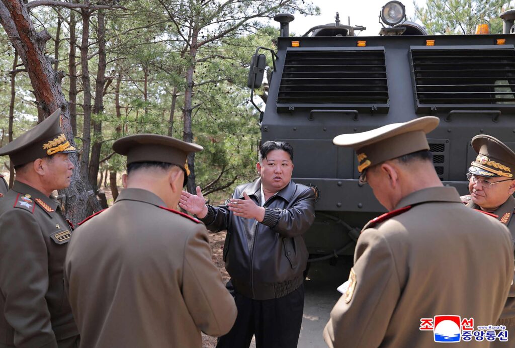 This picture taken on May 8, 2025 and released by North Korea's official Korean Central News Agency (KCNA) on May 9, 2025 shows North Korean leader Kim Jong Un (C) inspecting a joint striking drill of long-range artillery and missile systems of the Korean People's Army eastern front division, at an undisclosed location in North Korea. (AFP)