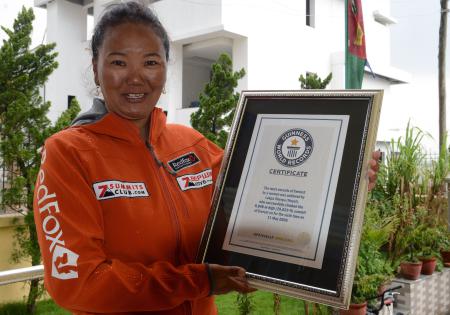 Nepalese climber Lhakpa Sherpa, who holds the world record for most successful climbs of Mount Everest for a woman with seven ascents, poses with her Guinness record certificate in Kathmandu on May 27, 2016. (AFP file)