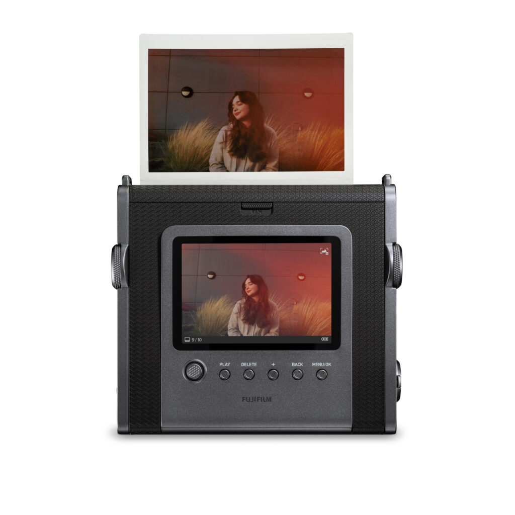 Users can operate the camera using dials and a mechanical print crank designed to replicate analog usability. (Supplied)