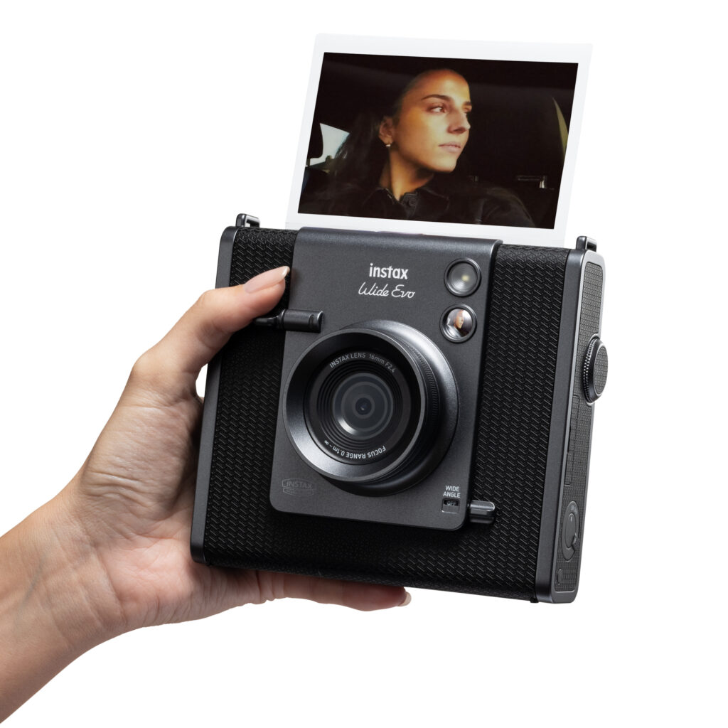 Users can operate the camera using dials and a mechanical print crank designed to replicate analog usability. (Supplied)