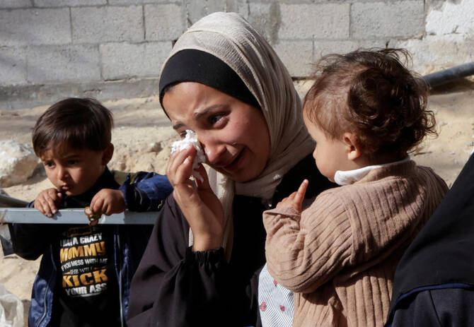 A woman reacts as she attends the funeral of Palestinians killed in Israeli strikes, in Khan Younis, southern Gaza Strip, May 3, 2025. (Reuters)