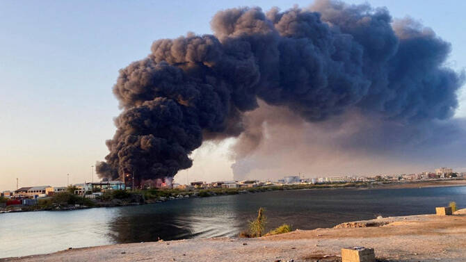 A view shows a large plume of smoke and fire rising from fuel depot in Port Sudan, Sudan, May 6, 2025. (Reuters)