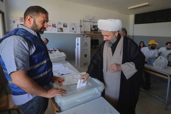 A Shiite cleric casting his ballot vote in Nabatieh, Lebanon. (AP)