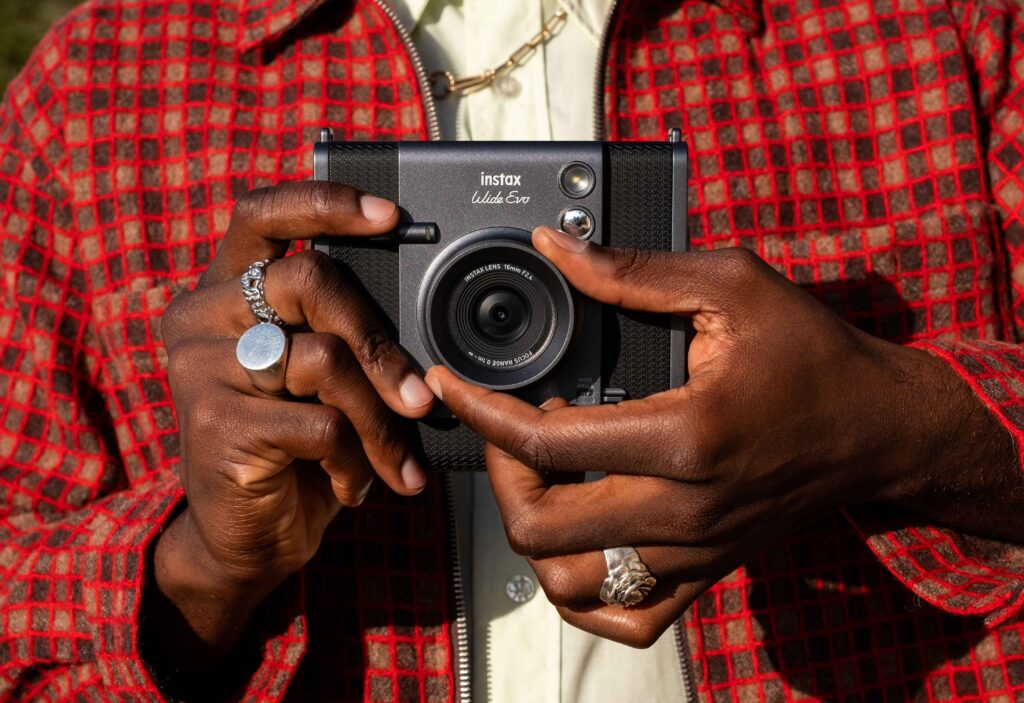 Users can operate the camera using dials and a mechanical print crank designed to replicate analog usability. (Supplied)