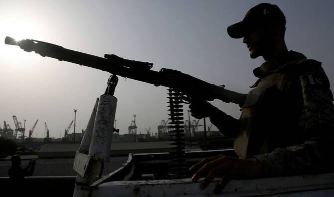 A paramilitary trooper mans a gun atop a vehicle as he keeps guard during a media tour of the Karachi Port, Pakistan, May 9, 2025. (Reuters/File)