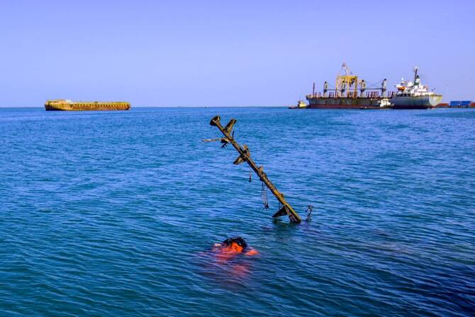 A sunken vessel is pictured at a site hit by Israeli forces in the Houthi-controlled port of Hodeida on the Red Sea on December 21, 2024. (File/AFP)