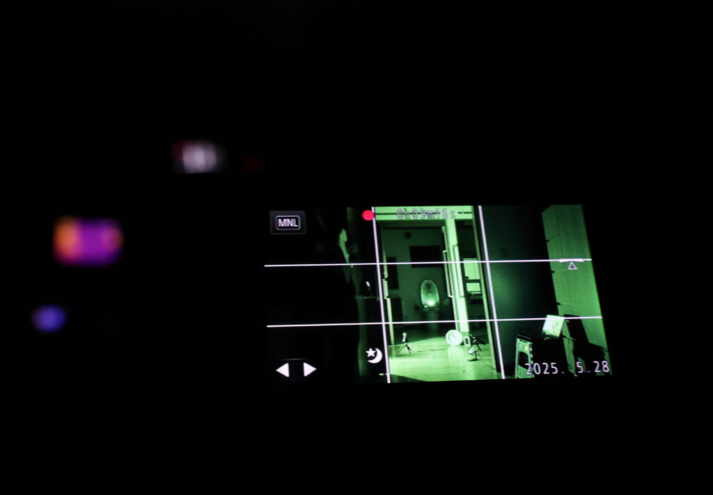 An Infrared image on a video camera is pictured while real estate consultant Kazutoshi Kodama conducts a 'ghost investigation' at a house where an elderly woman had hanged herself seven years ago and her son died and went undiscovered for roughly 10 days last year, in Chiba Prefecture, near Tokyo. (Reuters)
