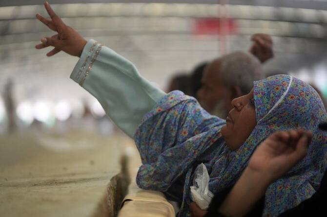 Muslim pilgrims cast stones at pillars in the symbolic stoning of the devil, the last rite of the annual Hajj, in Mina near the holy city of Makkah, Saudi Arabia, Friday, June 6, 2025. (AP)