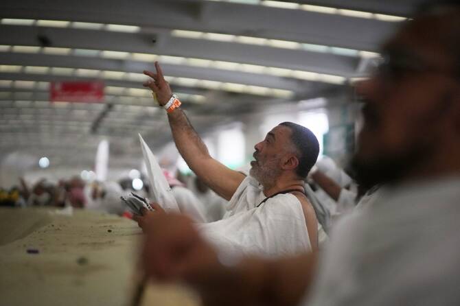 Muslim pilgrims cast stones at pillars in the symbolic stoning of the devil, the last rite of the annual Hajj, in Mina near the holy city of Makkah, Saudi Arabia, Friday, June 6, 2025. (AP)