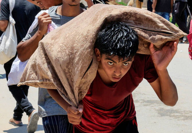 A Palestinian collects aid supplies from the U.S.-backed Gaza Humanitarian Foundation, in Rafah, in the southern Gaza Strip, June 9, 2025. (REUTERS)