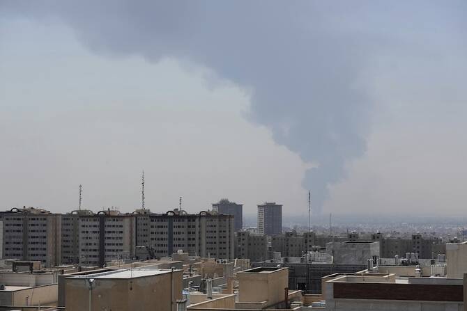 Huge smoke rises up from an oil facility after a Saturday explosion in southern Tehran on June 15, 2025. (AP)