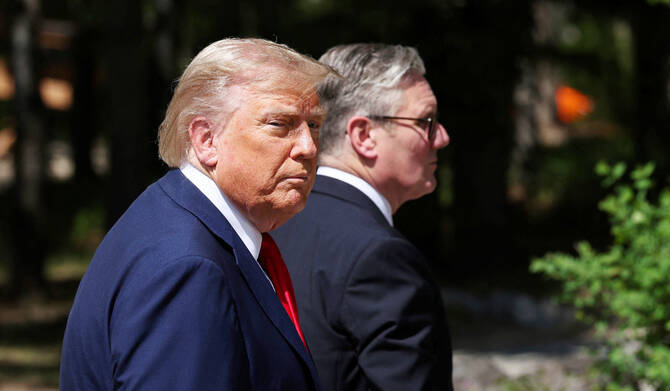 U.S. President Donald Trump, left, and Britain's Prime Minister Keir Starmer walk at the G7 summit, in Kananaskis, Alberta, Monday, June 16, 2025. (AP)