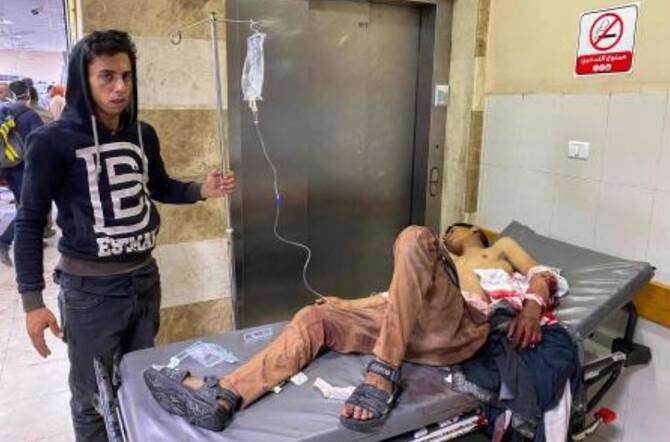 Palestinians who were injured in Israeli fire as they gathered near a food aid center, receive care at Khan Yunis’ Nasser hospital in the southern Gaza Strip on Jun. 17, 2025. (AFP)