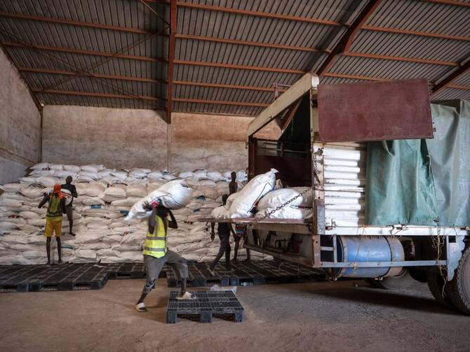 Workers load food aid onto a Fogbow truck as part of an aid program operated by retired American military officers at an airport in Juba, South Sudan, Jun. 9, 2025. (AP)
