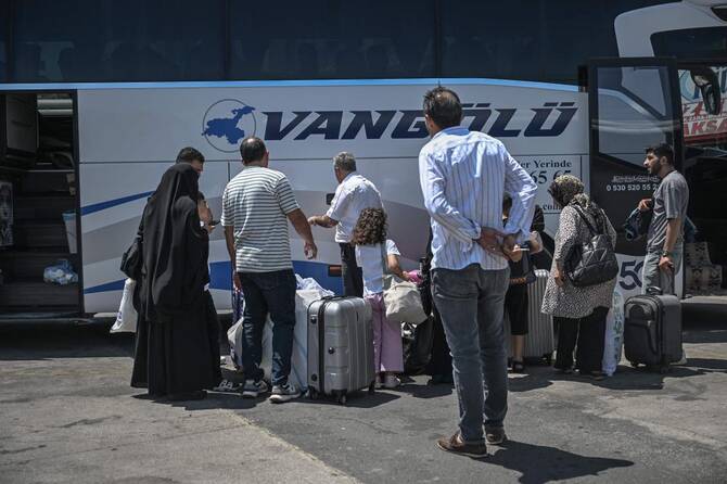 Mostly Iranian citizens board a bus traveling to Van, a city in eastern Turkiye near the border with Iran, at the Esenler bus terminal in Istanbul, on Jun. 18, 2025. (AFP)