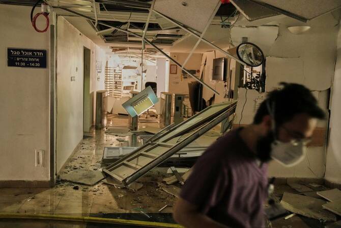 A medical staffer walks in a damaged area of the Soroka hospital complex in Beersheba, Israel, after it was hit by a missile fired from Iran, Thursday, June 19, 2025. (AP Photo)