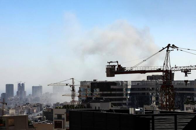 Smoke rises above buildings in Tehran following an Israeli strike on June 18, 2025. (AFP)