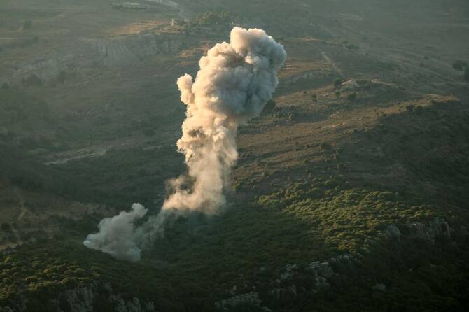A plume of smoke rises above hills after an Israeli strike in the southern Lebanese Jezzine district on June 20, 2025. The Lebanese health ministry said an Israeli strike on south Lebanon killed one person on Juen 20, as Israel said it killed a member of Iran-backed militant group Hezbollah. (Photo by Rabih DAHER / AFP)