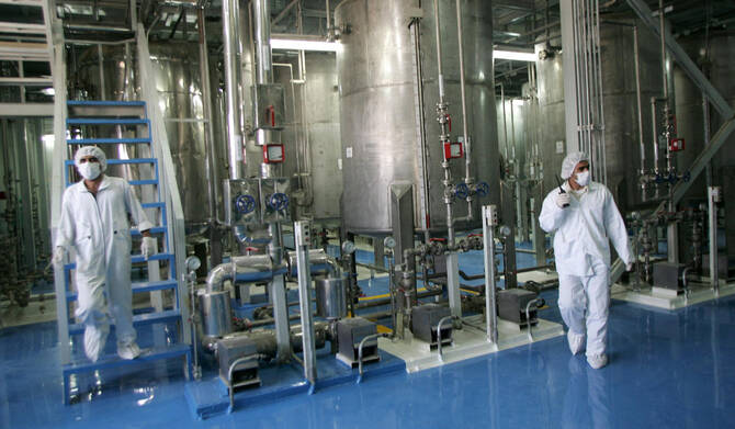 Iranian technicians work at the Isfahan Uranium Conversion Facilities (UCF), 420 kms south of Tehran, on August 8, 2005. (AFP file photo)