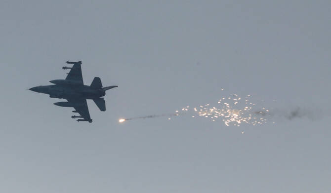 An Israeli aircraft fires a flare, in Gaza City, June 22, 2025. (REUTERS)