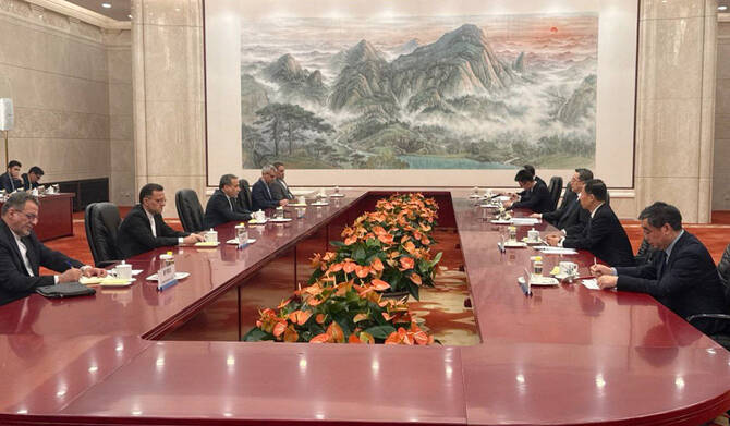 This handout picture provided by the Iranian foreign ministry shows Chinese Vice Premier Ding Xuexiang (3rd-R) meeting with Iran's Foreign Minister Abbas Araghchi (3rd-R) in Beijing on April 23, 2025. (AFP)