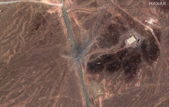 Satellite images from before Sunday’s attacks showed a long line of vehicles outside the Fordow plant. (MAXAR)