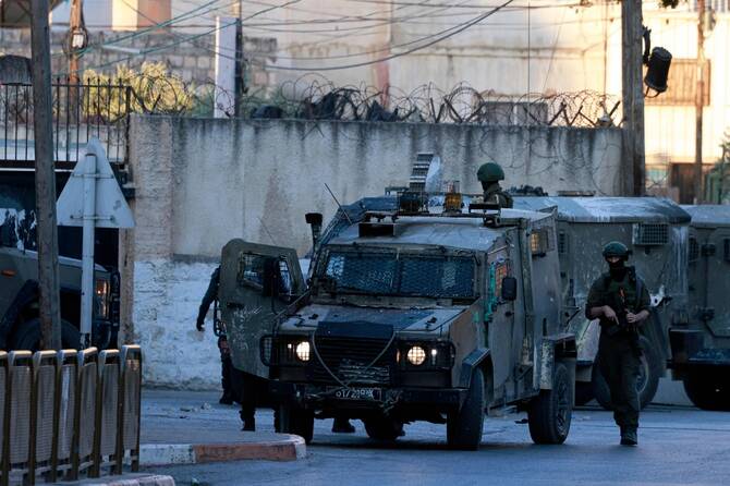 Israeli army forces deploy near the religious site of Joseph's Tomb in the occupied West Bank city of Nablus. (AFP)
