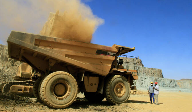 An Ariab company truck is loaded with earth at a mine prospecting for gold in the Sudanese desert, 800 kms northeast of the capital Khartoum, on October 3, 2011. (AFP file photo)