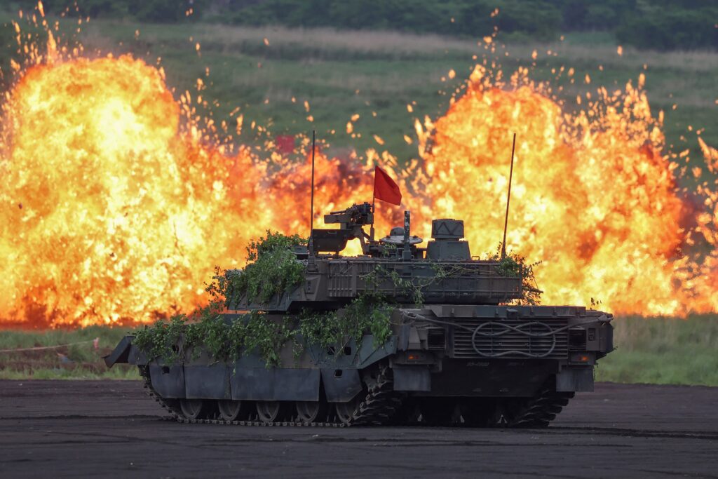 A Japan Ground Self-Defence Force (JGSDF) battle tank takes part in a live fire exercise at the Higashifuji training area in Gotemba, Shizuoka Prefecture on June 8. (AFP)