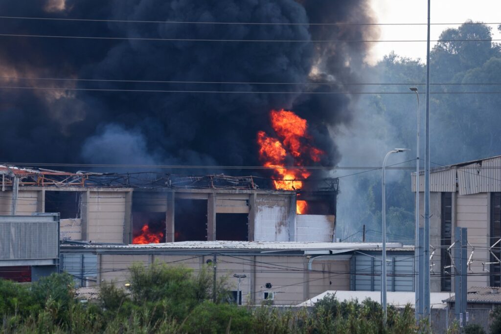 Smoke billows from a fire in a building in Herzliya near Tel Aviv following a fresh barrage of Iranian rockets on June 17, 2025.