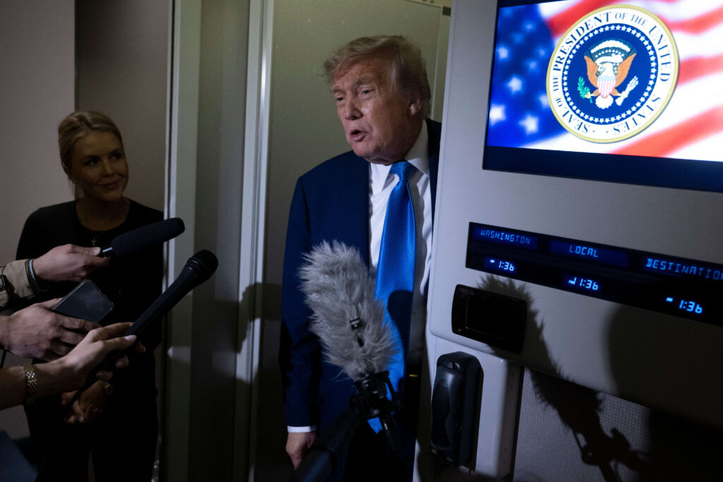 Donald Trump speaks to reporters about the G7 Summit aboard Air Force One while travelling back to Washington from Canada on June 16. (AFP)
