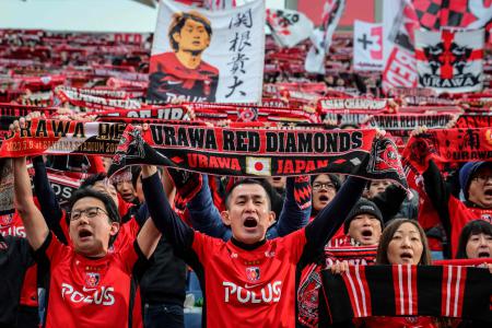 (FILES) Fans celebrate Urawa's victory after the J-League football match between Urawa Red Diamonds and Fagiano Okayama at Saitama stadium 2002 in Saitama city on March 8, 2025. (AFP)