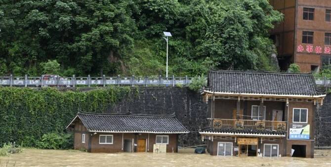 The flood of the Bala River rose after heavy rain in Qiandongnan Miao and Dong Autonomous Prefecture, Guizhou Province, China. (AFP)