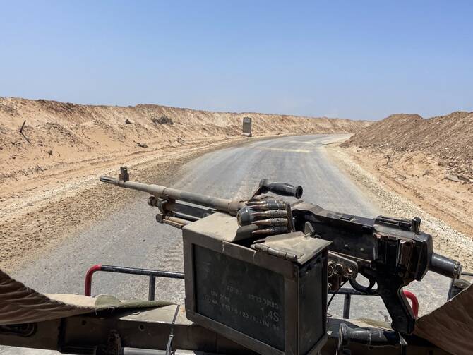 An Israeli military vehicle drives through the so-called Morag Corridor in Khan Yunis in the Gaza Strip, June 8, 2025. (AFP)