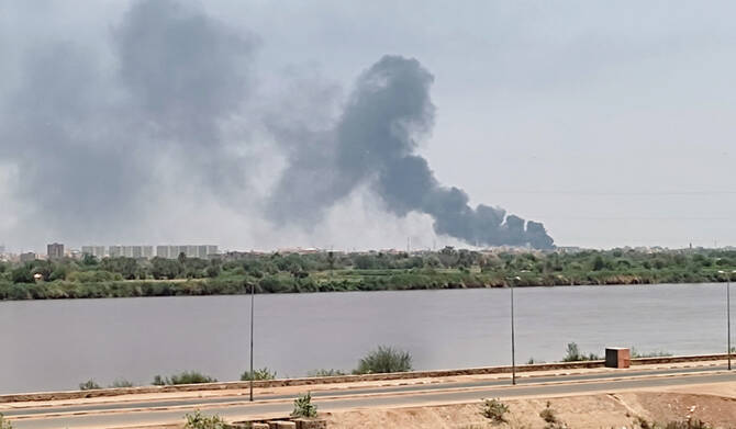A picture taken from Omdurman shows smoke billowing in the distance in Khartoum North amid ongoing fighting in war-torn Sudan, on July 18, 2023. (AFP file photo)