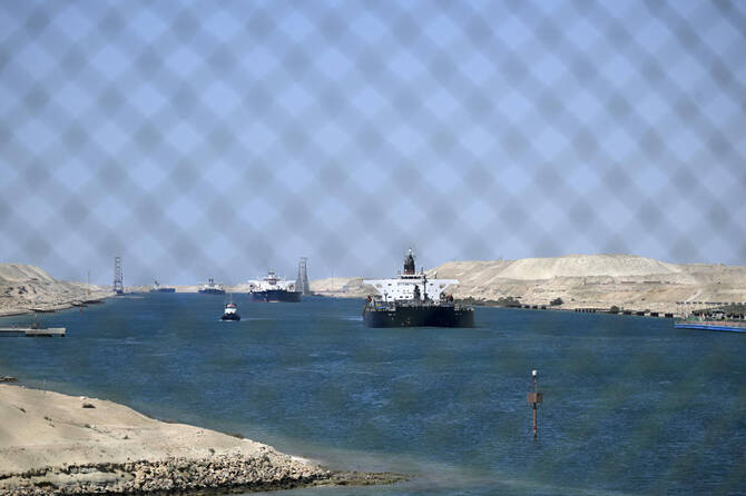 Ships sail along Egypt's Suez Canal near Ismailia on April 16, 2025. (Photo by Khaled DESOUKI / AFP)