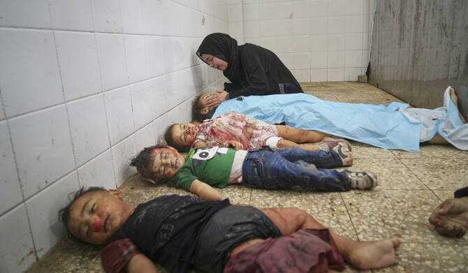 Sara Al-Nouri mourns over the body of her 13-year-old sister, Sama, who was among 10 children and five adults killed by an Israeli strike outside a medical clinic while they were waiting to receive nutritional supplements at a Project Hope-run medical clinic in Deir al-Balah, Gaza Strip, Thursday, July 10, 2025. (AP)