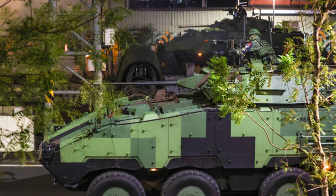 Soldiers riding a CM-34 Clouded Leopard, officially Taiwan Infantry Fighting Vehicle (TIFV), take part in the annual Han Kuang military exercises in Taipei on July 15, 2025. (AFP)