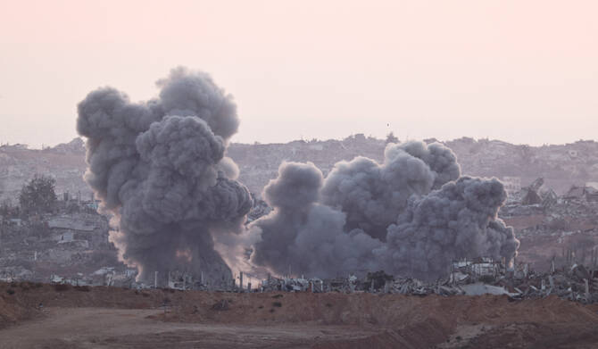Explosions send smoke and debris into the air in Gaza, as seen from the Israeli side of the border, July 17, 2025. (REUTERS)