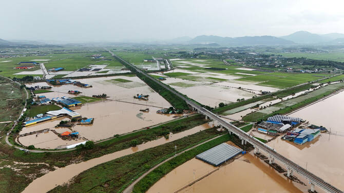 Houses and rice fields are submerged during flooding caused by torrential rain, in Yesan, South Korea on July 18, 2025. (Reuters)
