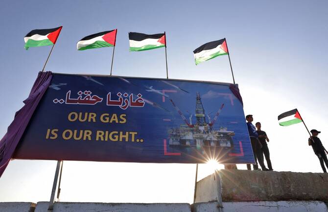 Palestinians participate in a rally in 2022 at the Gaza City sea port, in which they demand their right to receive gas from maritime fields in the eastern Mediterranean. (AFP/File Photo)