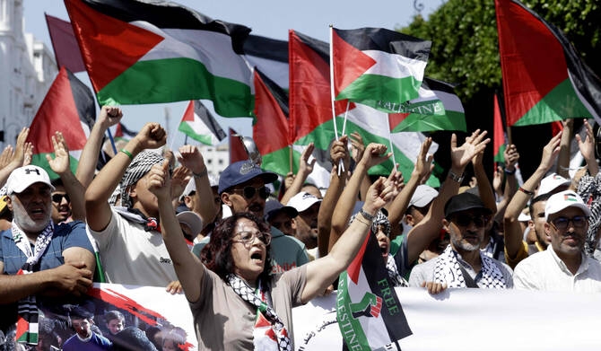 Moroccans chant slogans and wave the Palestinian flag during a march to express their solidarity with the Palestinians in the Gaza Strip, in Rabat on July 19, 2025. (AFP)