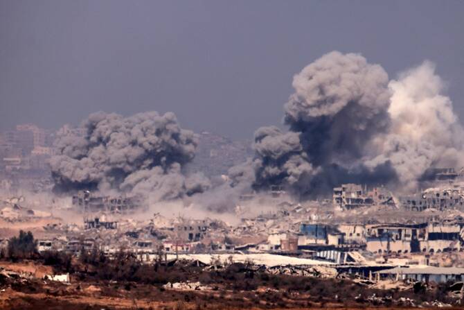 Thick smoke billowing during Israeli strikes on the besieged Palestinian territory on July 27, 2025. (AFP)