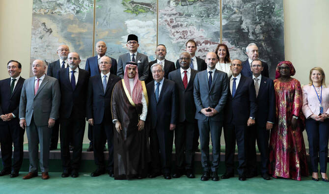 At center front row, UN Secretary General Antonio Guterres, conference co-chair Saudi Arabia's Foreign Minister Faisal bin Farhan Al-Saud and conference co-chair French Foreign Minister Jean-Noel Barrot (front, 5R) stand for a group photo with high level ministers during the United Nations conference on a two state solution for Israel and the Palestinians, at UN headquarters on July 28, 2025, in New York City. (AFP)