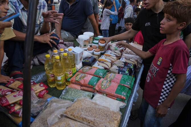 Palestinian vendors display goods for sale at a street market in Gaza City. (AP)